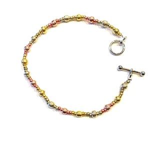 Silver, gold, and bronze bracelet